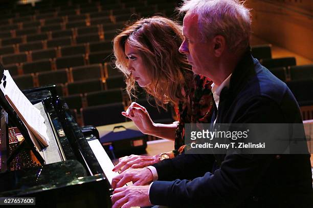 Presenter Myleene Klass and television executive Peter Fincham rehearse at a Steinway piano before a performance of 'Word And Play Celebrity...