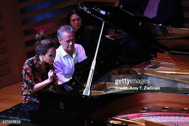 Presenter Myleene Klass and television executive Peter Fincham perform a selection of Grieg's Lyric Pieces during 'Word And Play Celebrity Christmas...