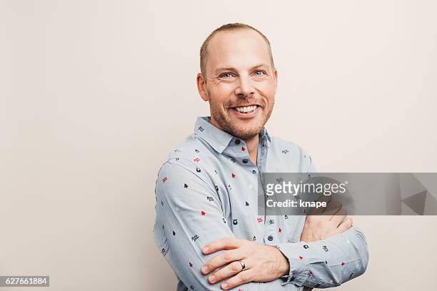 handsome real man in christmas shirt smiling - mid adult men stock pictures, royalty-free photos & images