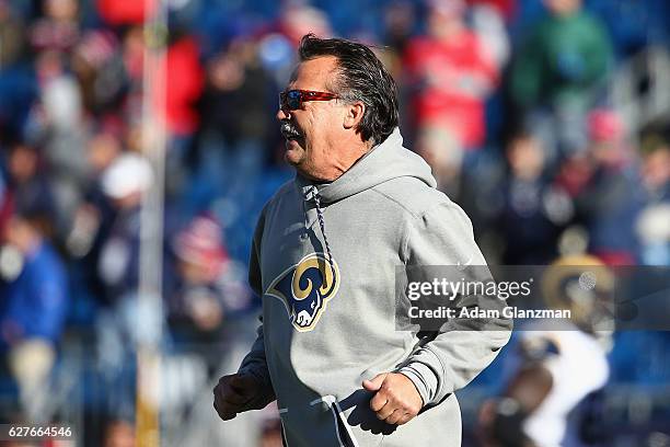 Head coach Jeff Fisher of the Los Angeles Rams walks on the field before the game against the New England Patriots at Gillette Stadium on December 4,...