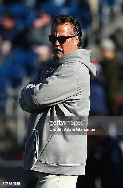 Head coach Jeff Fisher of the Los Angeles Rams stands on the field before the game against the New England Patriots at Gillette Stadium on December...