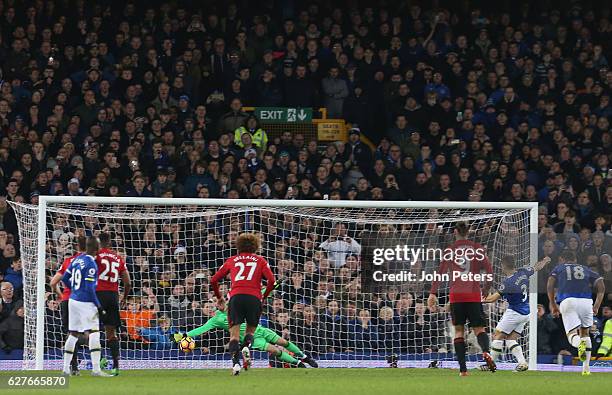 Leighton Baines of Everton scores their first goal during the Premier League match between Everton and Manchester United at Goodison Park on December...