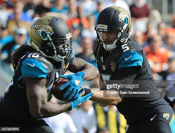 Denard Robinson of the Jacksonville Jaguars takes a handoff from Blake Bortles against the Denver Broncos at EverBank Field on December 4, 2016 in...