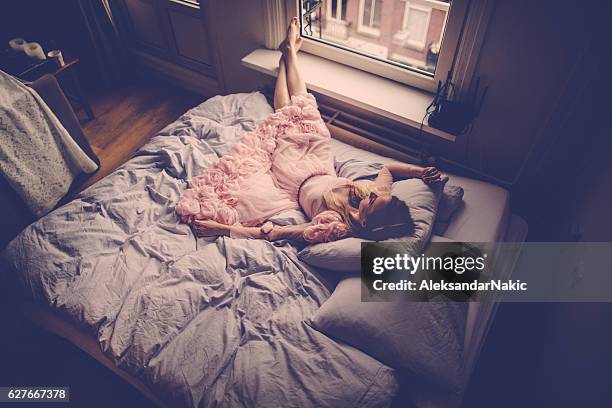 sleeping beauty - pink dress stock pictures, royalty-free photos & images