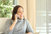 Woman talking on a land line phone