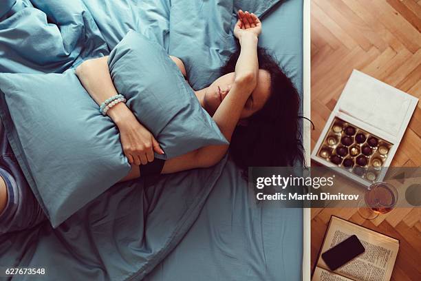 sad woman resting at home - hang over stock pictures, royalty-free photos & images