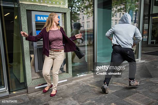 cashpoint machine - man stealing stock pictures, royalty-free photos & images