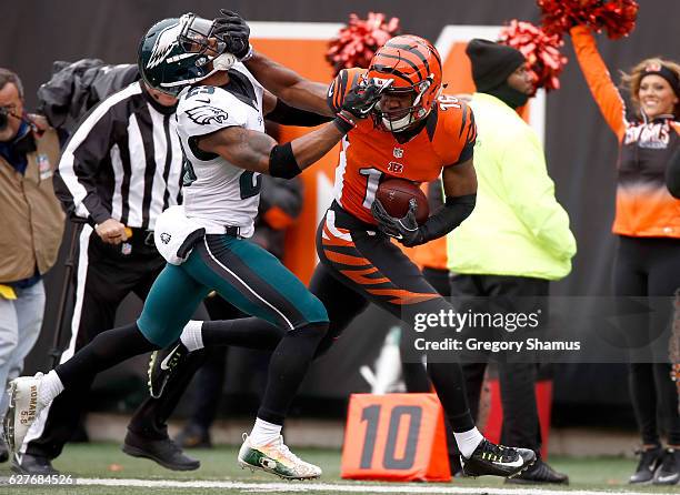 Cody Core of the Cincinnati Bengals stiff-arms Rodney McLeod of the Philadelphia Eagles during the first quarter at Paul Brown Stadium on December 4,...