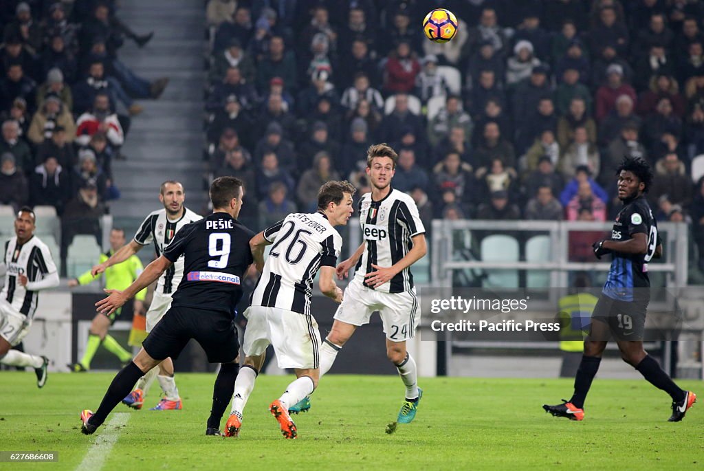 Aleksandar Pesic of Atalanta (left) and Stephan Lichtsteiner...