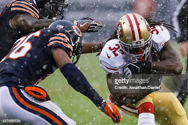 DuJuan Harris of the San Francisco 49ers carries the football against the Chicago Bears in the second quarter at Soldier Field on December 4, 2016 in...
