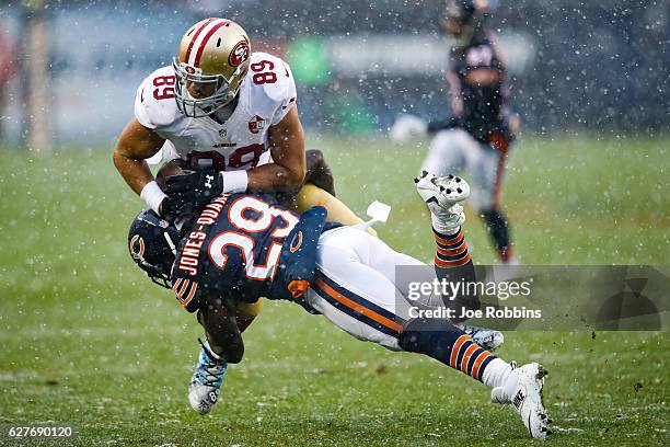 Harold Jones-Quartey of the Chicago Bears hits Vance McDonald of the San Francisco 49ers in the second quarter at Soldier Field on December 4, 2016...