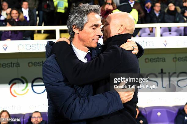 Head coaches Paulo asousa of Fiorentina and Eugenio Corini of Palermo hug each other during the Serie A match between ACF Fiorentina and US Citta di...