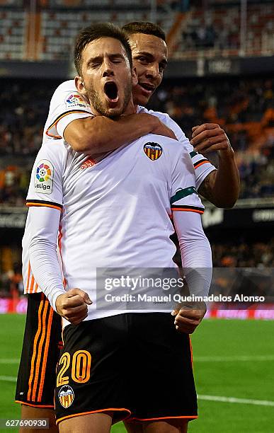 Alvaro Medran of Valencia celebrates scoring his team's second goal with his teammate Rodrigo Moreno during the La Liga match between Valencia CF and...