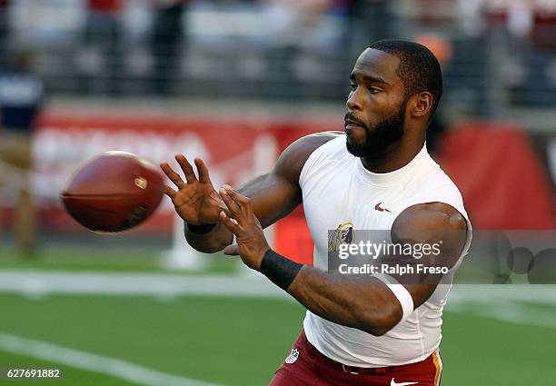 Pierre Garcon of the Washington Redskins catches a pass before the start of an NFL game against the Arizona Cardinals at University of Phoenix...