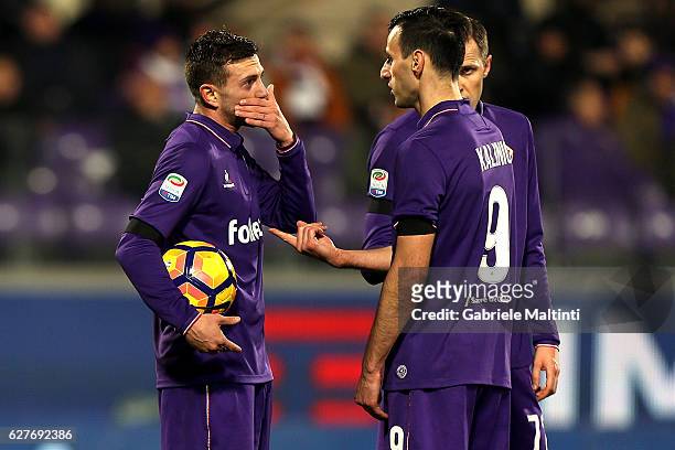Federico Bernardeschi of ACF Fiorentina talks with Nikola Kalinic and Josip Ilicic before kicking the penalty during the Serie A match between ACF...