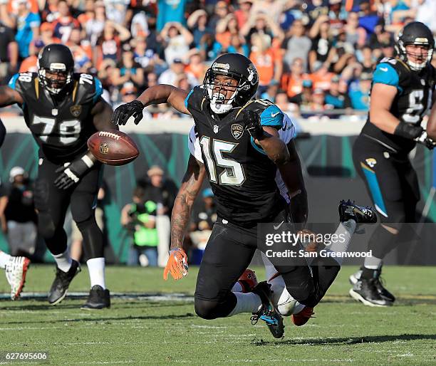 Allen Robinson of the Jacksonville Jaguars tries to catch a pass against the Denver Broncos at EverBank Field on December 4, 2016 in Jacksonville,...