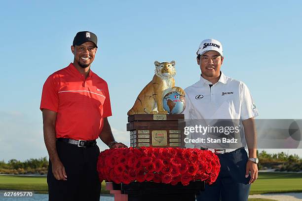 Tournament host Tiger Woods and Hideki Matsuyama of Japan poses with the winner's trophy during the Hero World Challenge at Albany course on December...