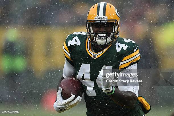 James Starks of the Green Bay Packers runs for yards during the first half of a game against the Houston Texans at Lambeau Field on December 4, 2016...