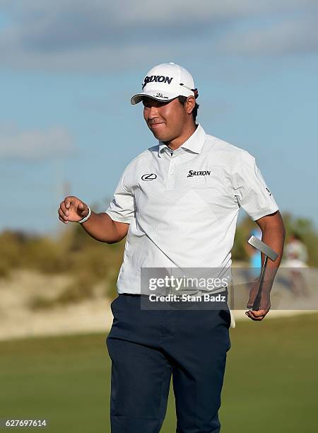 Hideki Matsuyama of Japan reacts with a smile on the 18th green after winning the Hero World Challenge at Albany course on December 4, 2016 in...