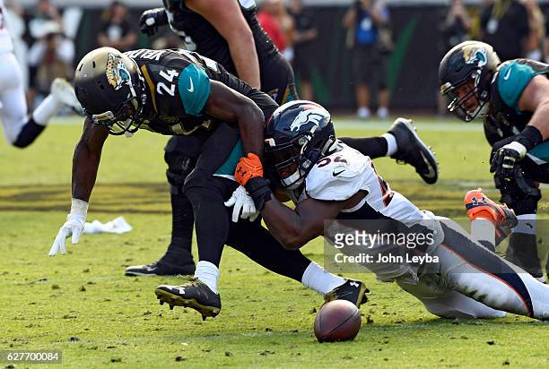 Denver Broncos inside linebacker Corey Nelson breaks up a pas intended for Jacksonville Jaguars running back T.J. Yeldon during the fourth quarter...