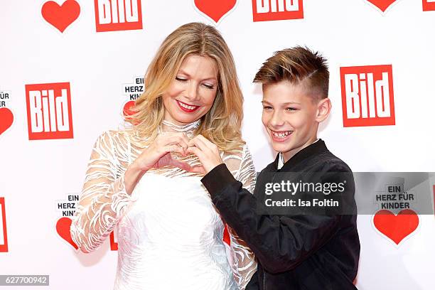 German actress Ursula Karven and her son Liam Taj Veres attend the Ein Herz Fuer Kinder gala on December 3, 2016 in Berlin, Germany.