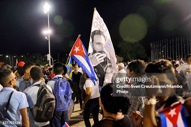 Cubans participate in a memorial tribute in Revolution Square December 3 in Santiago de Cuba, Cuba. The tribute is for Cubas former President, the...
