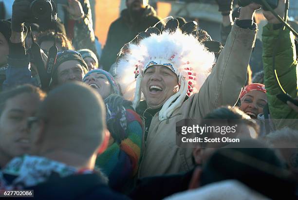 Native American and other activists celebrate after learning an easement had been denied for the Dakota Access Pipeline at Oceti Sakowin Camp on the...