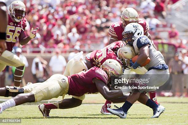 Florida State LB Dontavious Jackson tackles Charleston Southern RB Kelan Fraise during the game between the Florida State Seminoles and the...