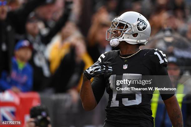 Michael Crabtree of the Oakland Raiders celebrates after a touchdown against the Buffalo Bills during their NFL game at Oakland Alameda Coliseum on...