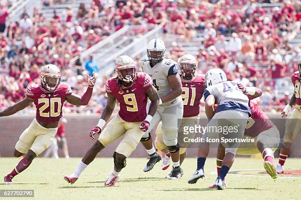 Florida State DB Trey Marshall and Florida State DE Josh Sweat look to tackle Charleston Southern RB Kelan Fraise during the game between the Florida...