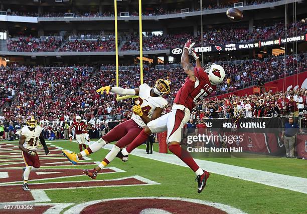 Michael Floyd of the Arizona Cardinals cannot make a leaping catch in the endzone while being defended by Josh Norman of the Washington Redskins...