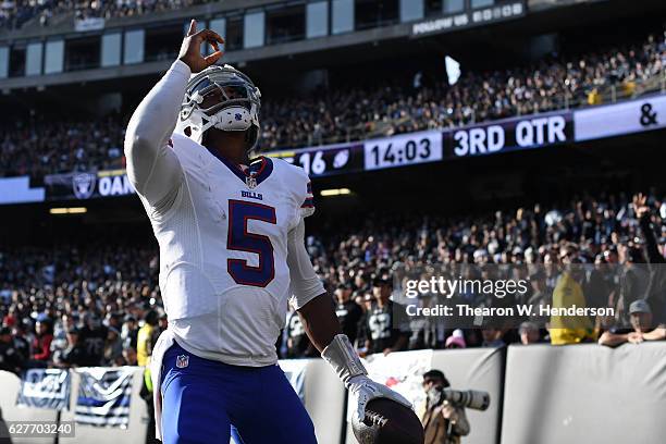 Tyrod Taylor of the Buffalo Bills celebrates after 12-yard touchdown against the Oakland Raiders during their NFL game at Oakland Alameda Coliseum on...