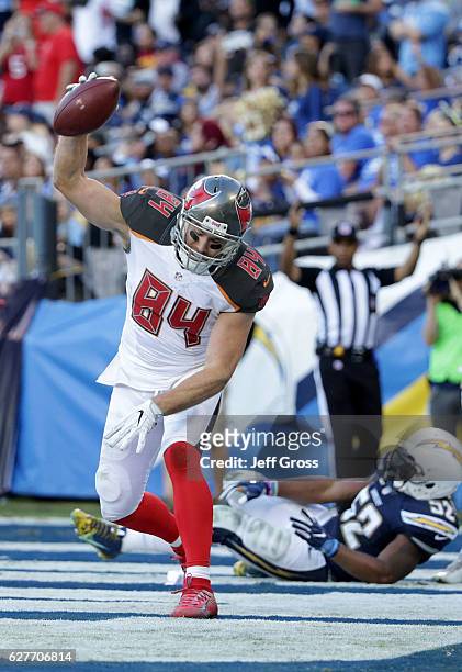 Cameron Brate of the Tampa Bay Buccaneers spikes the ball after scoring a touchdown against the San Diego Chargers in the fourth quarter at Qualcomm...