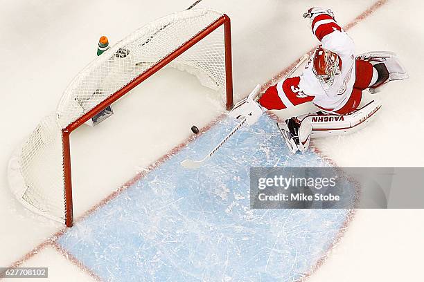 Petr Mrazek of the Detroit Red Wings watches Anders Lee of the New York Islanders first period goal into the net at the Barclays Center on December...