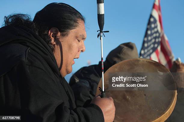 Jason Umtuch sings at Oceti Sakowin Camp on the edge of the Standing Rock Sioux Reservation on December 4, 2016 outside Cannon Ball, North Dakota....