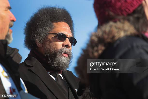 Political activist Cornel West listen to speakers during an interfaith ceremony at Oceti Sakowin Camp on the edge of the Standing Rock Sioux...