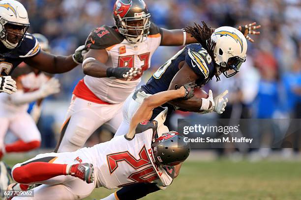 Gerald McCoy and Brent Grimes of the Tampa Bay Buccaneers tackle Melvin Gordon of the San Diego Chargers on a run play during the second half of a...