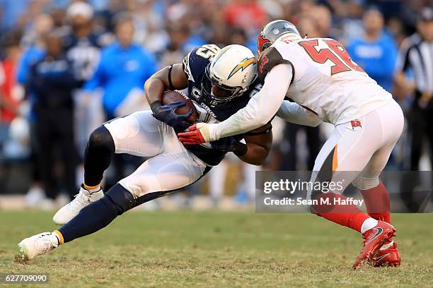Antonio Gates of the San Diego Chargers is tackled by Kwon Alexander of the Tampa Bay Buccaneers on a pass play during the second half of a game at...