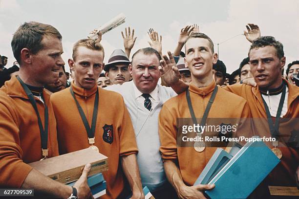 The Netherlands road cycling team celebrate with their gold medals after coming first in the Men's 100km Team Time Trial event at the 1968 Summer...