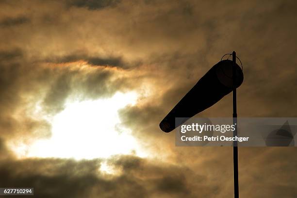 windy days. - windsock stock pictures, royalty-free photos & images