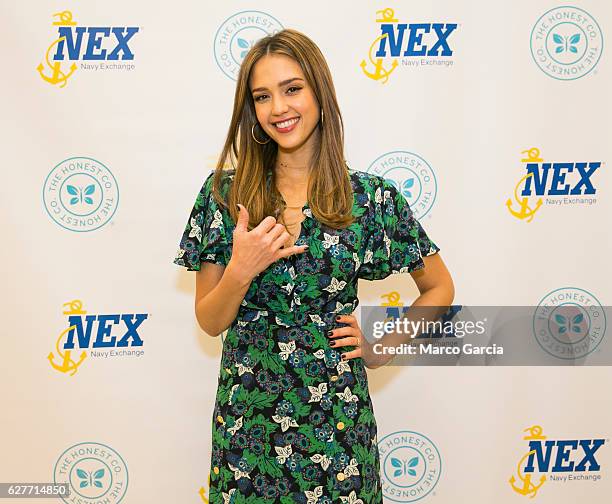 Jessica Alba flashes a Hawaiian shaka before a meet and greet hosted by the Honest Company at the Pearl Harbor NEX, December 4 in Honolulu, Hawaii.