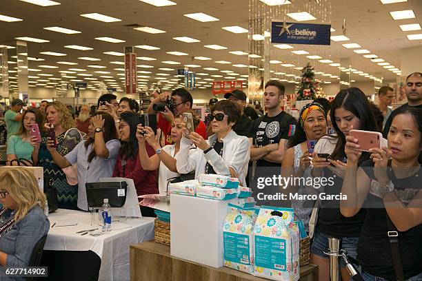 Crowds gather to see Jessica Alba at a meet and greet hosted by the Honest Company at the Pearl Harbor NEX, December 4 in Honolulu, Hawaii.