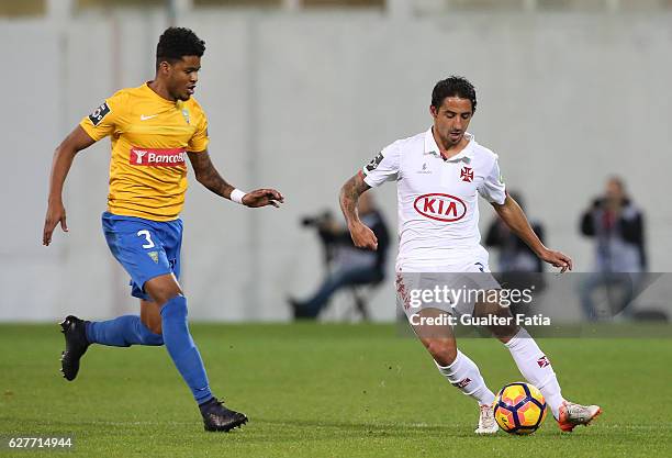 Belenenses's defender Joao Diogo from Portugal with Estoril's defender Ailton Silva from Brazil in action during the Primeira Liga match between GD...