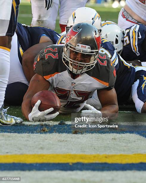 Tampa Bay Buccaneers Running Back Doug Martin squeezes through the Chargers line for a touchdown during the NFL football game between the Tampa Bay...
