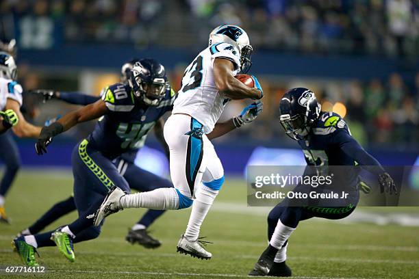 Running back Fozzy Whittaker of the Carolina Panthers rushes against the Seattle Seahawks at CenturyLink Field on December 4, 2016 in Seattle,...