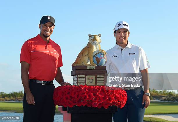 Tournament host Tiger Woods and Hideki Matsuyama of Japan poses with the winner's trophy during the Hero World Challenge at Albany course on December...