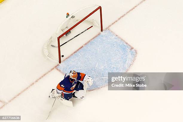 Jaroslav Halak of the New York Islanders looks on after giving up the game winning overtime goal to Danny DeKeyser of the Detroit Red Wings at the...