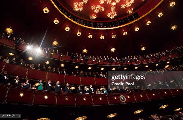 President Barack Obama, first lady Michelle Obama and the honorees listen to the US National Anthem during the Kennedy Center Honors show December 4,...