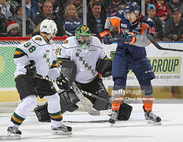 Tyler Parsons of the London Knights stops a shot right off of his mask against the Flint Firebirds during an OHL game at Budweiser Gardens on...