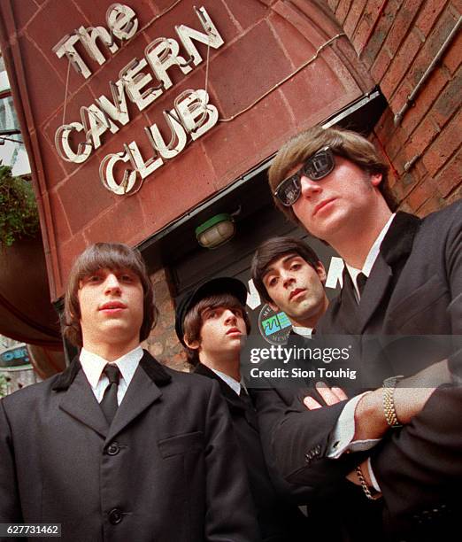 Members of the music group The Beats are dressed as The Beatles outside The Cavern Club in Liverpool, England. Diego Perez is John Lennon, Diego Mino...